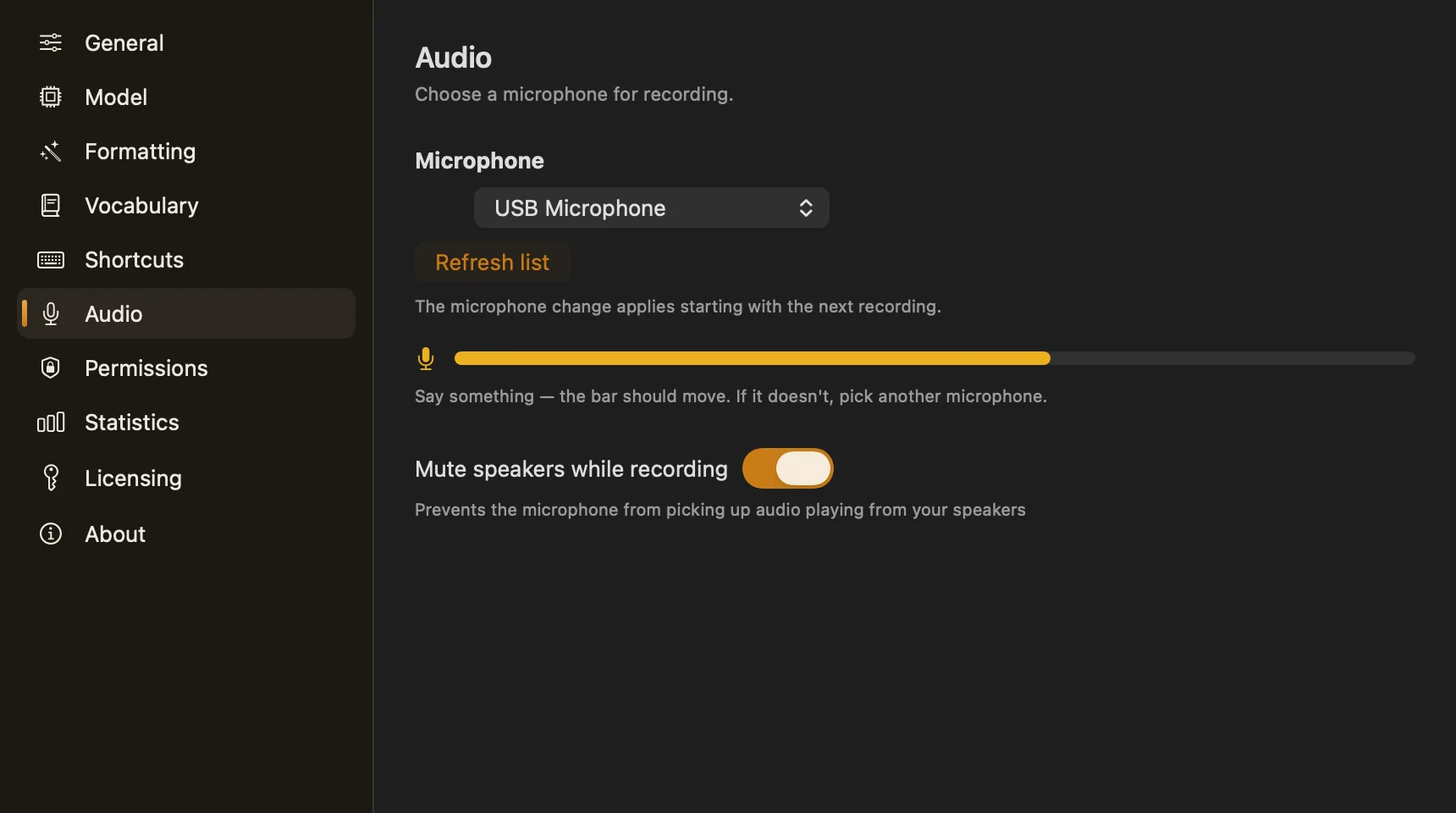 Audio settings: a USB Microphone selected, a live level meter, and Mute speakers while recording switched on.
